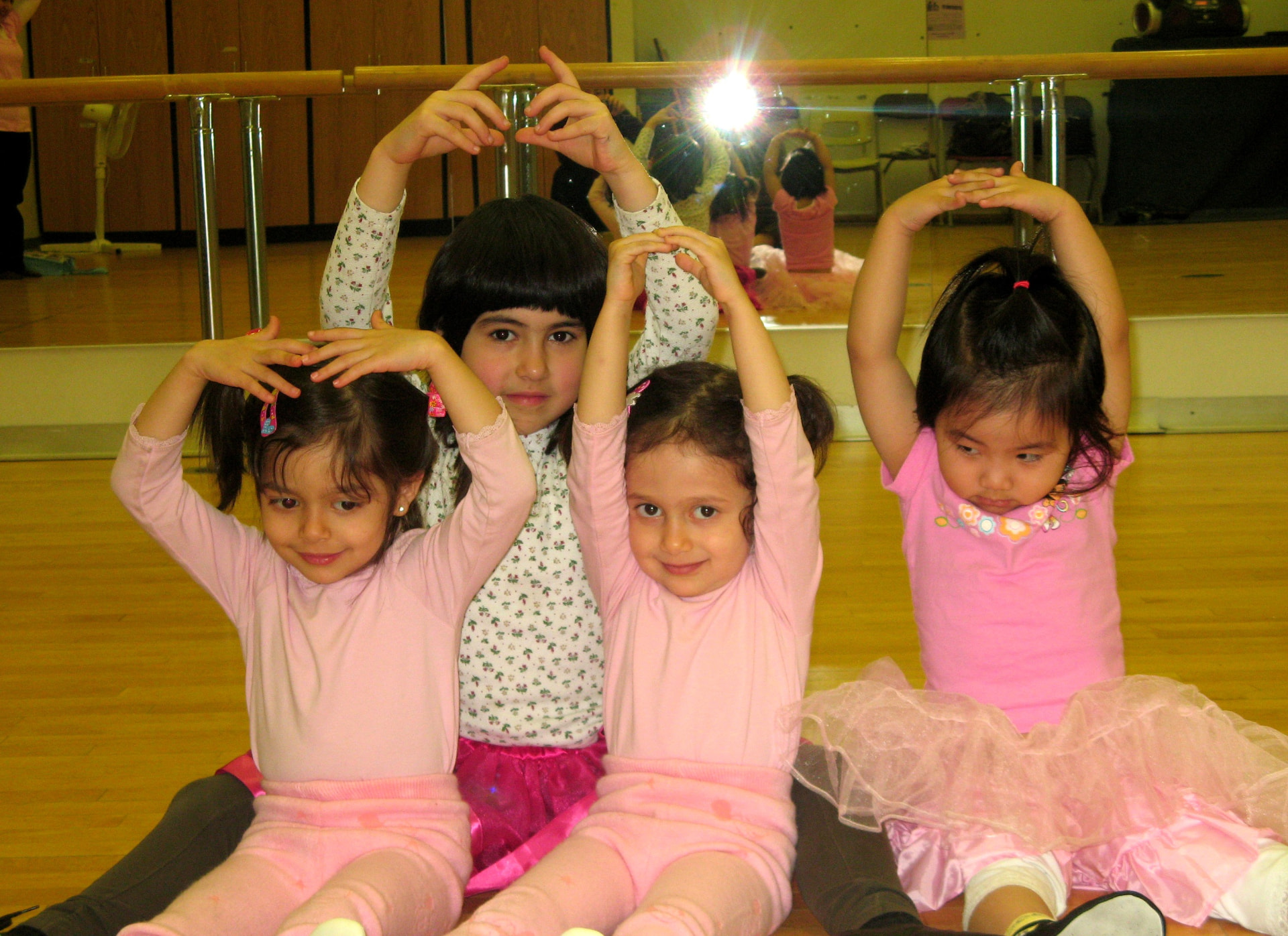 Children practising dance together in a studio